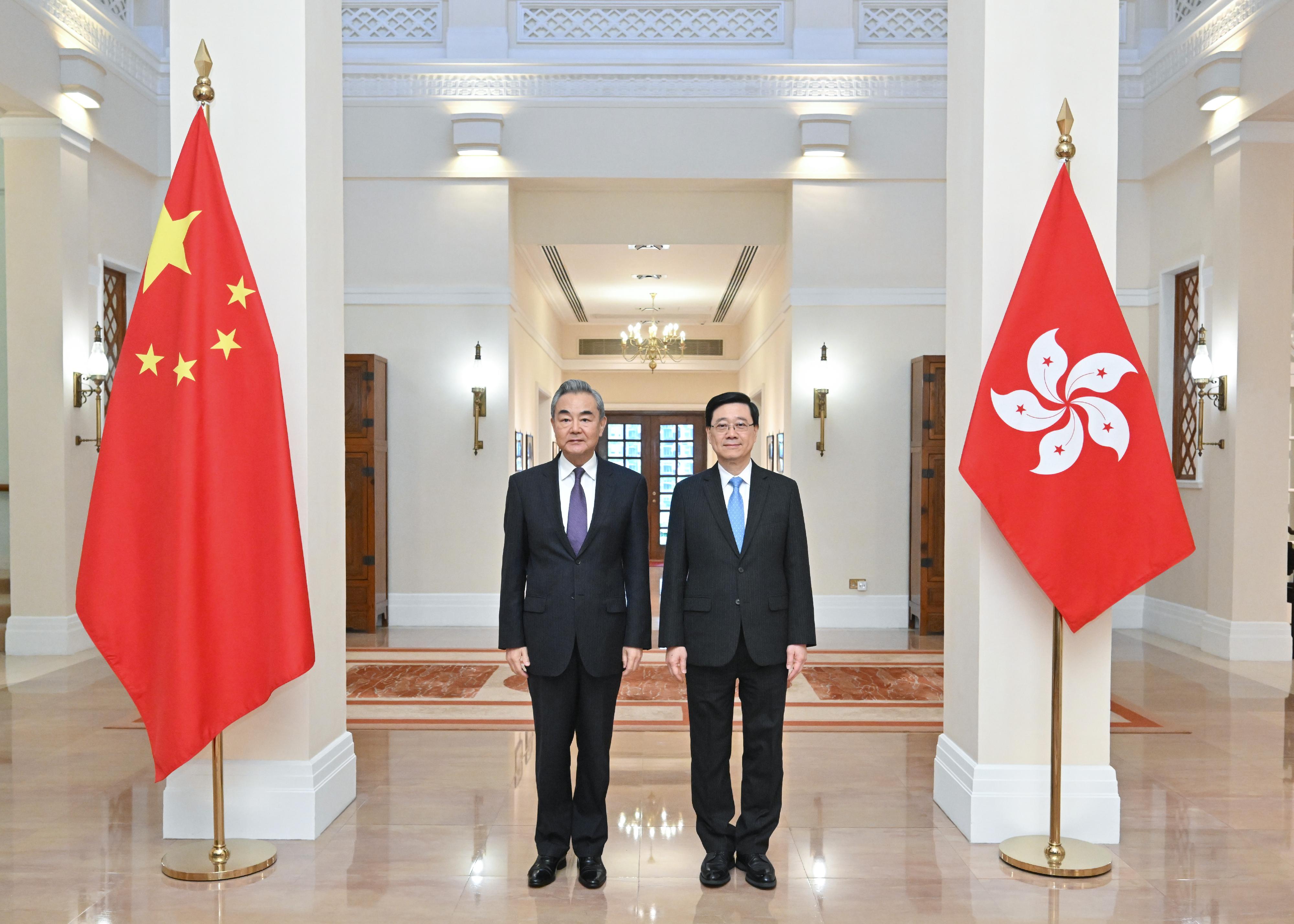 The Chief Executive, Mr John Lee (right), met with Member of the Political Bureau of the CPC Central Committee and Minister of Foreign Affairs, Mr Wang Yi (left), at Government House today (May 30).